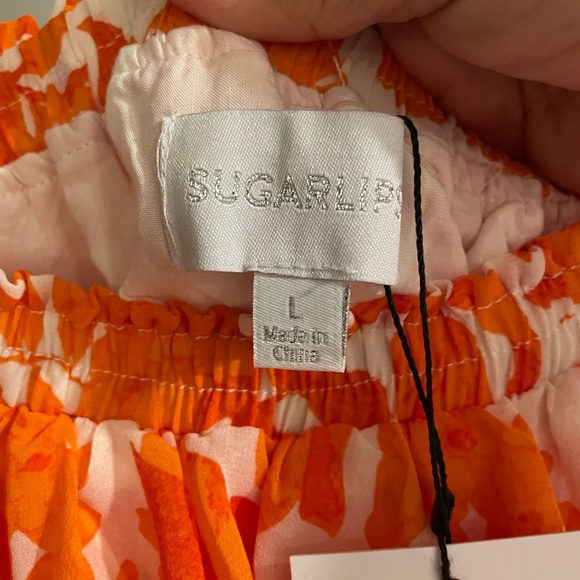 Sugarlips Romper. Size: Large. Orange and white flowers. NWT. Boutique. - Picture 2 of 9